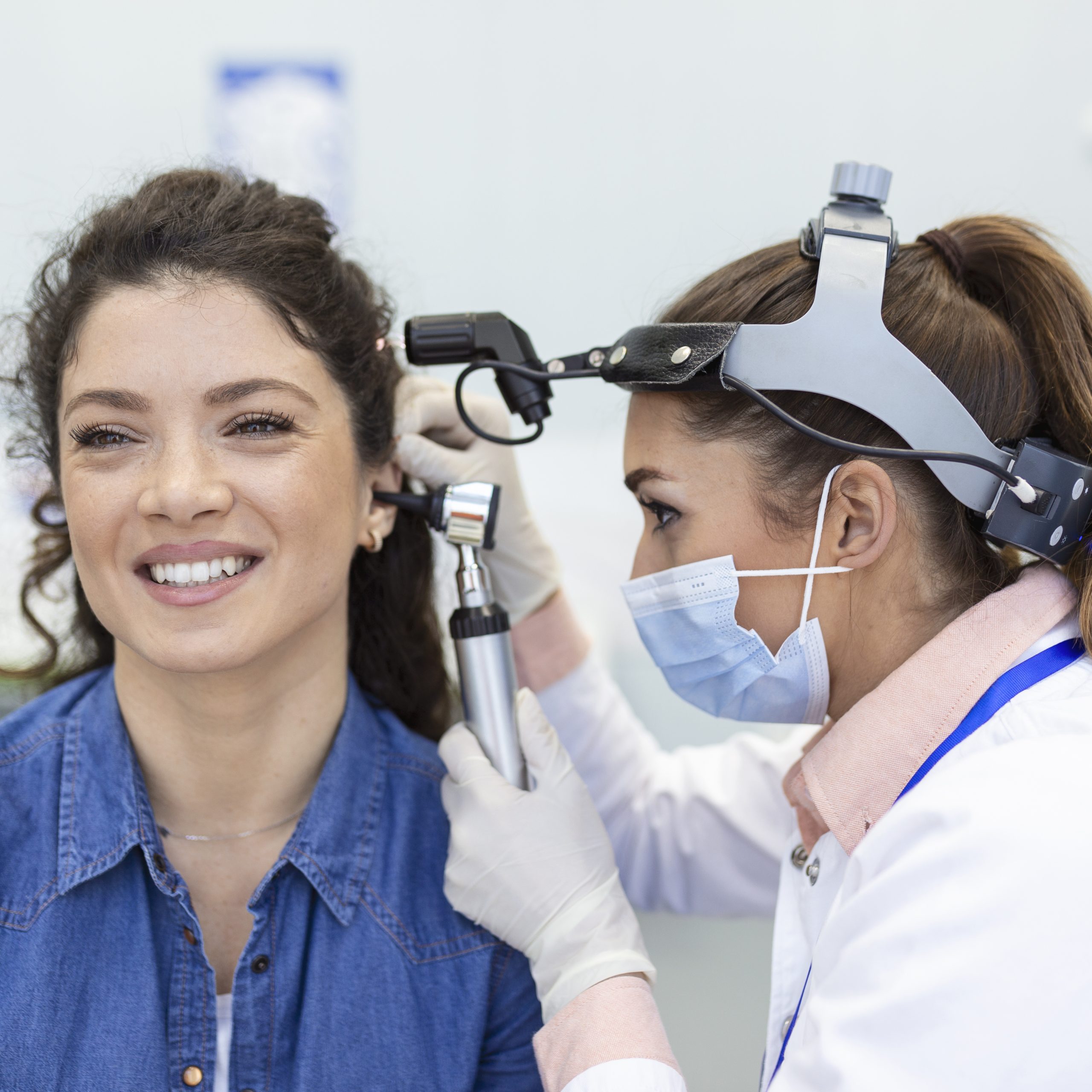 Clinician using magnification for ear care